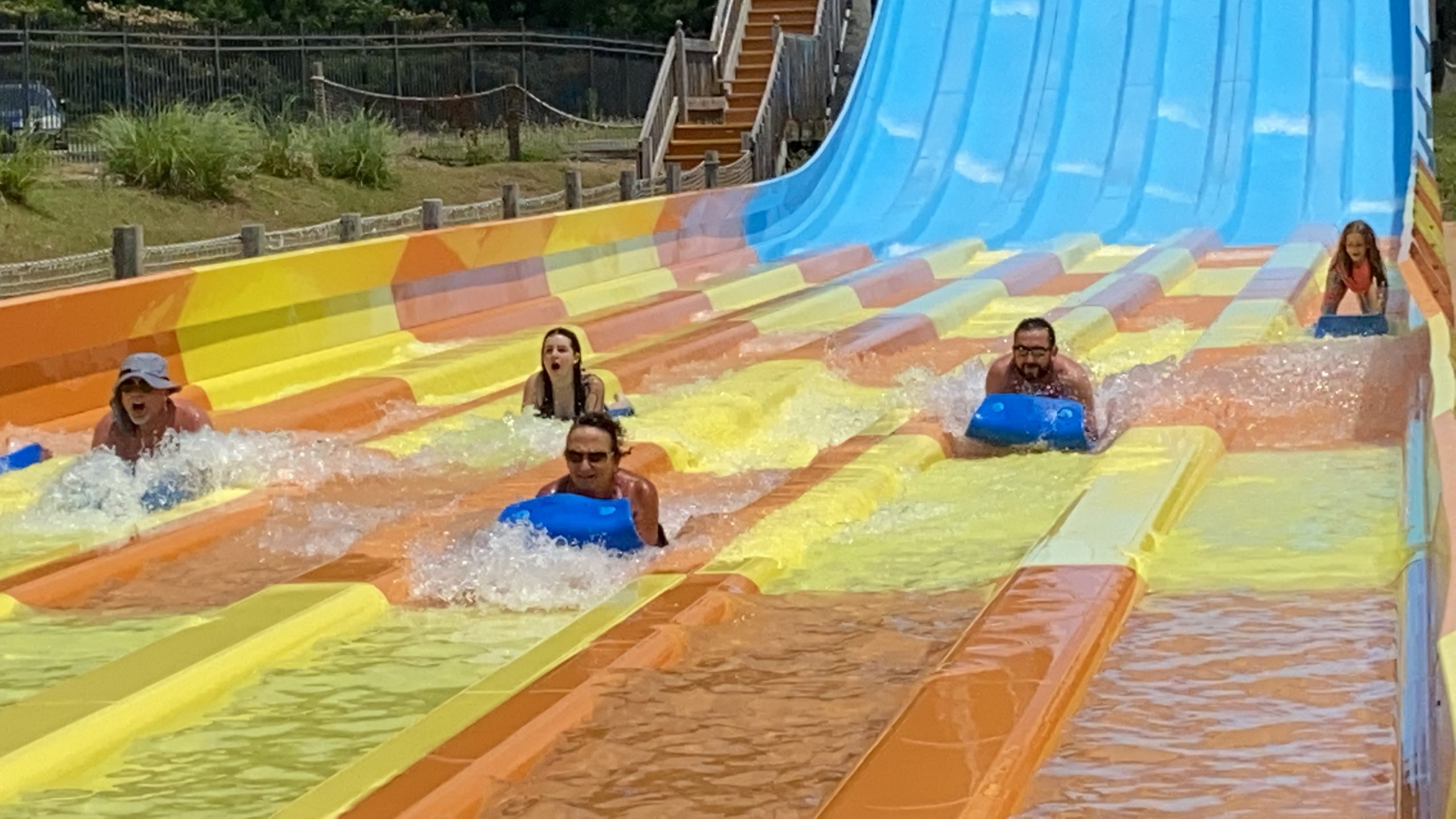 people going down waterslide at magic springs