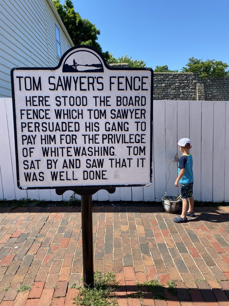 painting tom sawyer's fence in Hannibal