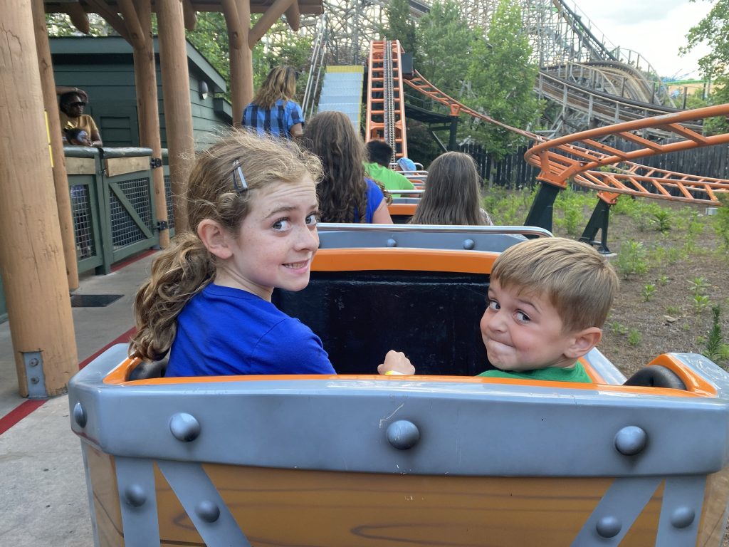 kids smiling on a ride