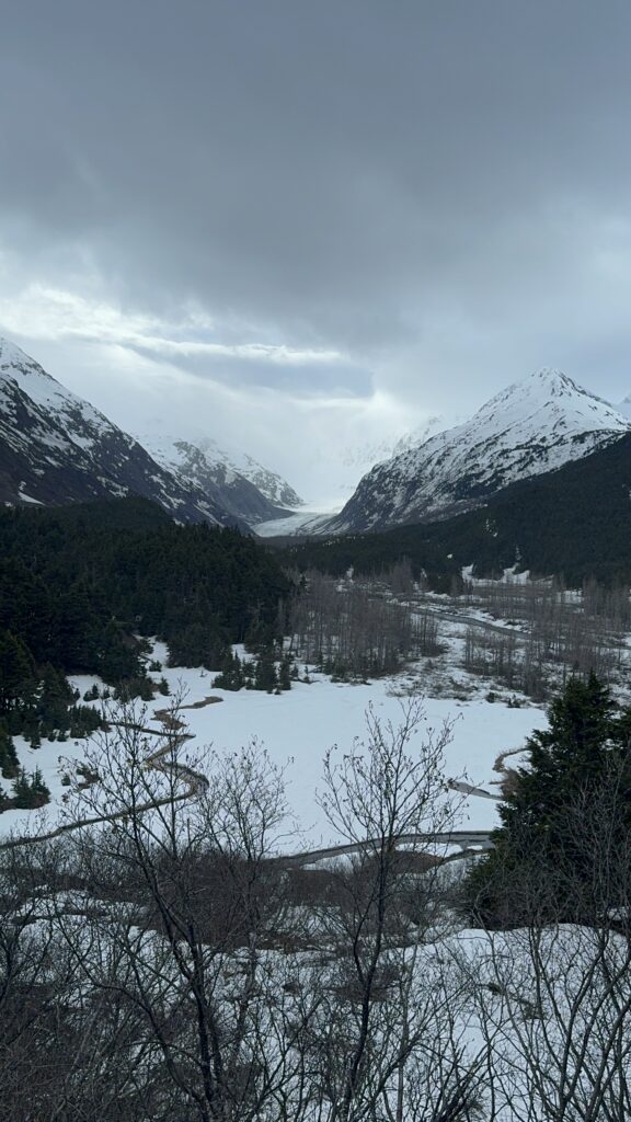 glacier peeking between mountains