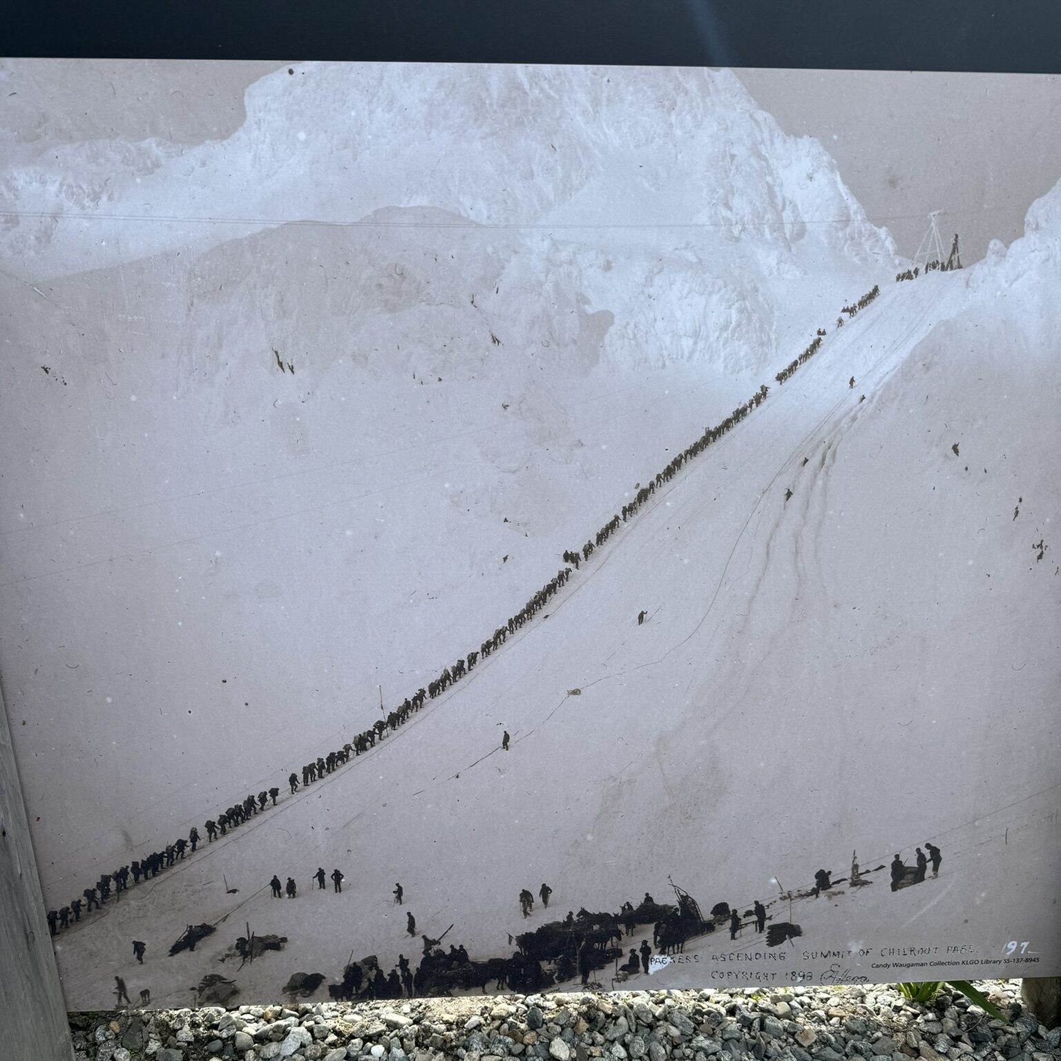 Prospectors summit Chilkoot Pass in 1898